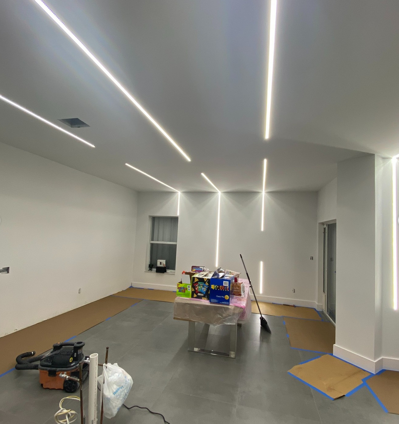 Full renovation with architectural linear LED lighting by Mozy Construction